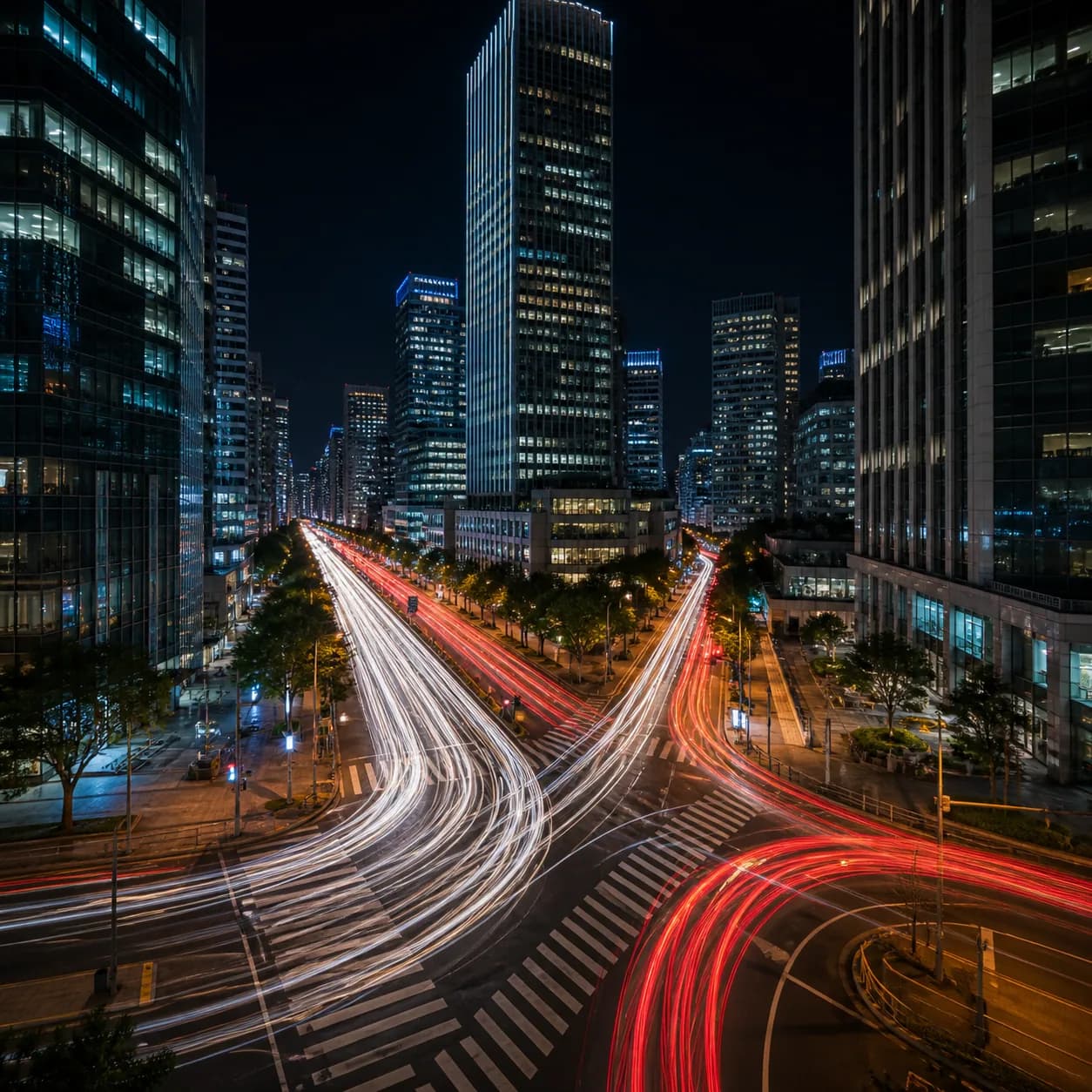 Long exposure photography example of city traffic trails at night.